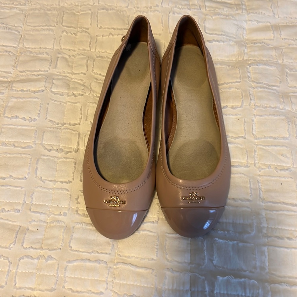 Light pink Coach ballet flats with insoles